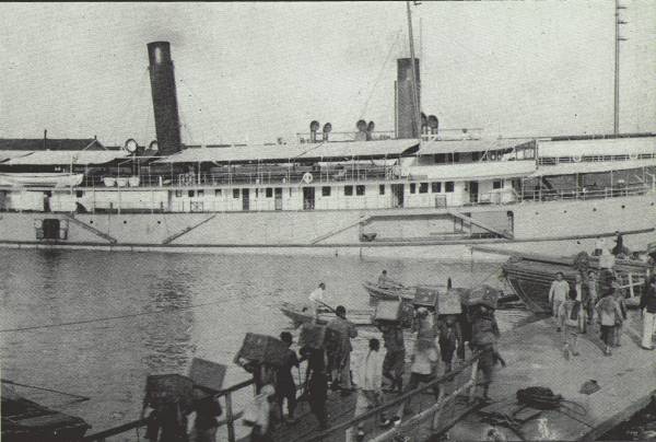 TEA FOR FOREIGN LANDS

Foreign steamers being loaded with native cargoes for export; scene on
the Hankow Bund. The tea trade of China has lost considerable ground in
recent years.