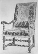 A typical Louis XIII chair, many of which were covered
 with velvet or tapestry.