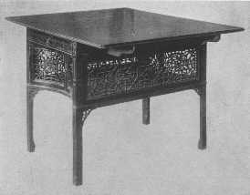 One of the most beautiful examples of Chippendale's
fretwork tea-tables in existence.
