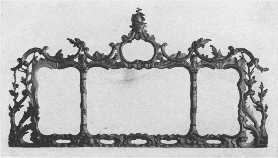 An elaborately carved and gilded Chippendale mantel
 mirror, showing French influence.
