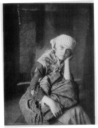 UNCONSCIOUS OF HER HANDICAPS SHE ANTICIPATES KEENLY LIFE
IN THE NEW WORLD