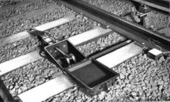 PNEUMATIC TRACK STOP, SHOWING STOP TRIGGER IN UPRIGHT
POSITION