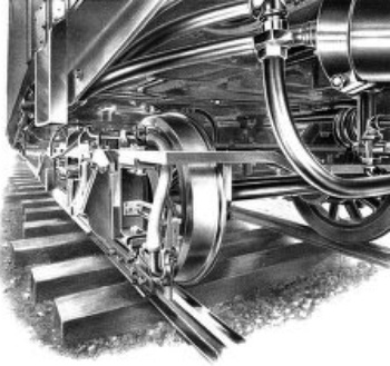 VIEW UNDER CAR, SHOWING TRIGGER ON TRUCK IN POSITION TO
ENGAGE WITH TRACK STOP