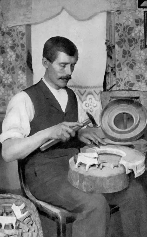 Toy-making in Germany.

How the rough figures are chipped from the wooden ring coming from the
cross-section of a tree.