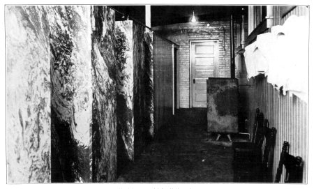 Shower baths installed in an old building in a crowded
section.