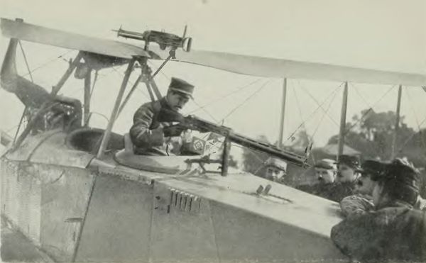 German Aeroplane Trophy--Jules Vedrine Examining the
Machine Gun
