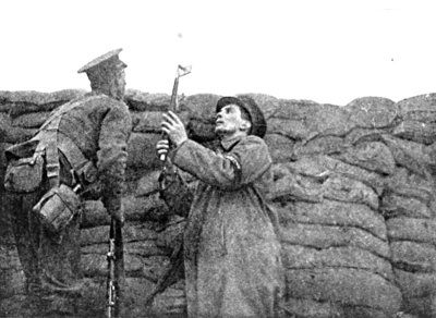 CHOOSING A POSITION FOR MY CAMERA IN THE FRONT LINE TRENCH AT PICANTIN, WITH THE GUARDS.
WINTER, 1915-16