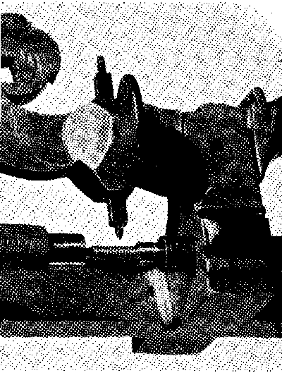 Figure 7.&mdash;Thread of modern form recently cut, using the
old screw and nut but with a new tool. The material threaded is
carbon-steel drill rod. (Smithsonian photo 49276A.)