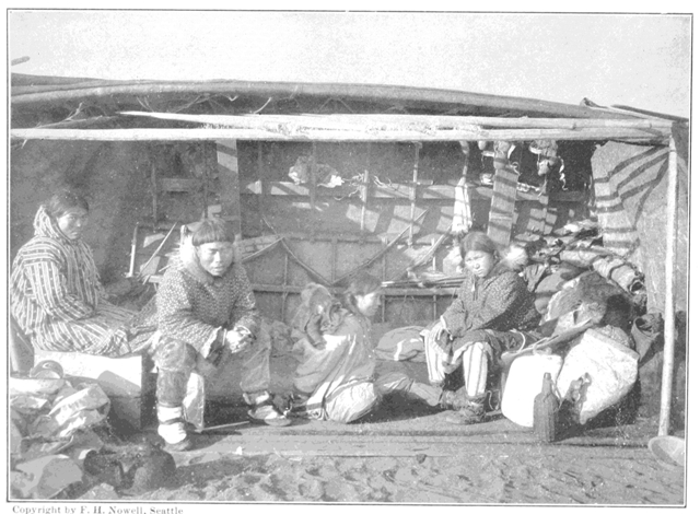 Copyright by F. H. Nowell, Seattle

Family of King's Island Eskimos living under Skin Boat, Nome