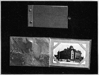 TWO VIEWS OF A POST CARD ALBUM&mdash;CLOSED AND OPEN.
