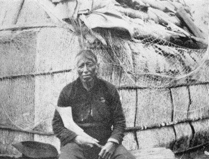 b. Outside an elm-bark structure. At the Ojibway village of Sagawamick, on south shore of
Mille Lac, Minnesota. May 21, 1900