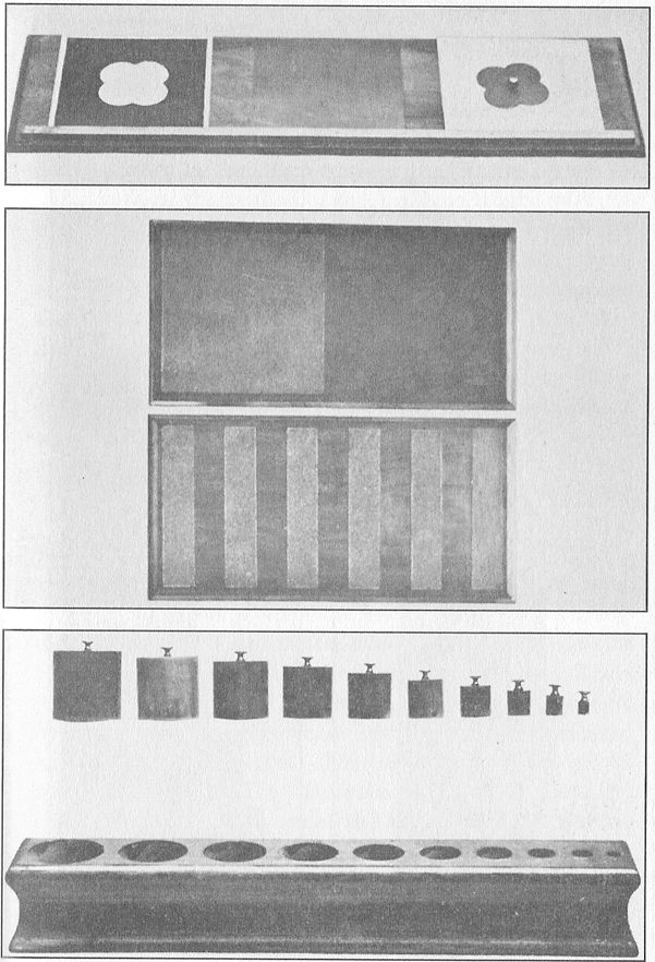 (A) DRAWING TABLE AND INSET. (B) WOODEN TABLETS. These are
partly covered with sandpaper to give rough and smooth surfaces.  (C) SOLID INSETS.
With these the child, working by himself, learns to differentiate objects according
to thickness, height, and size.