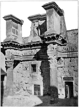PART OF THE BOUNDING WALL OF THE FORUM OF NERVA (FORUM
TRANSITORIUM) ROME: THE MODERN LEVEL AT LEAST TWENTY FEET ABOVE
ANCIENT PAVEMENT.
