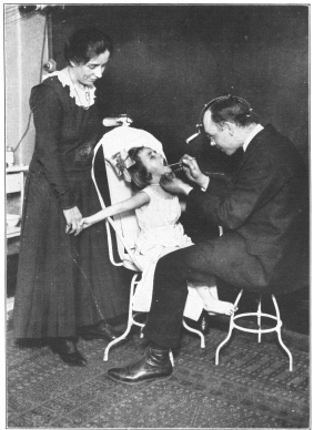 Photo, Paul Thompson


A THROAT EXAMINATION&mdash;IMPORTANT IN DETERMINING PHYSICAL FITNESS
